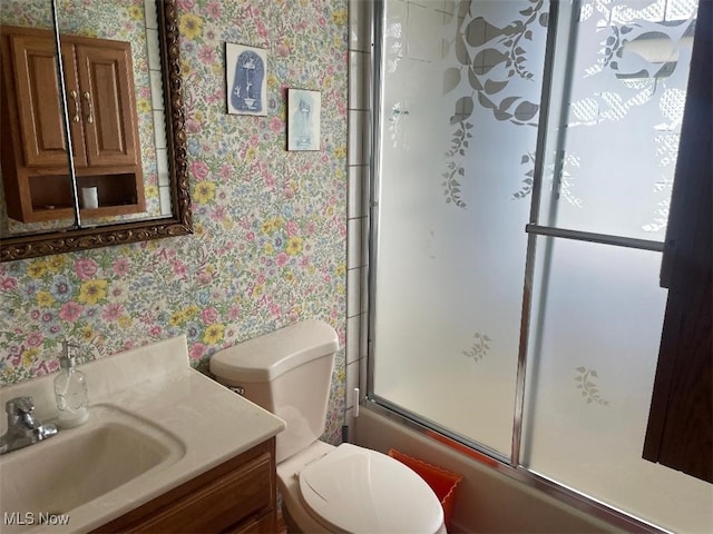 530 Center St, Hubbard, OH 44425 - bathroom with wallpapered walls, vanity, and shower / bath combination with glass door