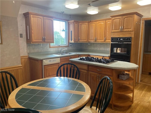 4520 E Wallings Rd, Broadview Heights, OH 44147 - kitchen featuring black oven, white dishwasher, stainless steel gas stovetop, a center island, and open shelves