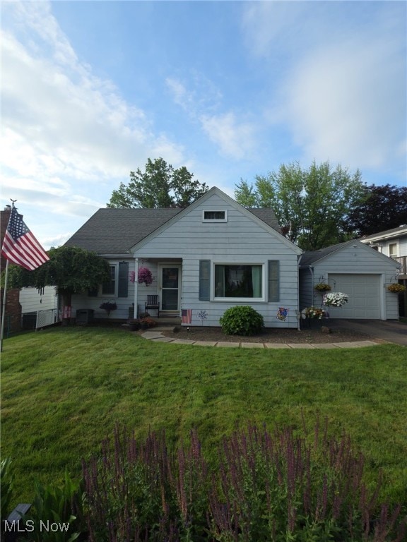 1730 Vine St, Coshocton, OH 43812 - bungalow-style home featuring a garage, concrete driveway, a front yard, entry steps, and an outdoor structure