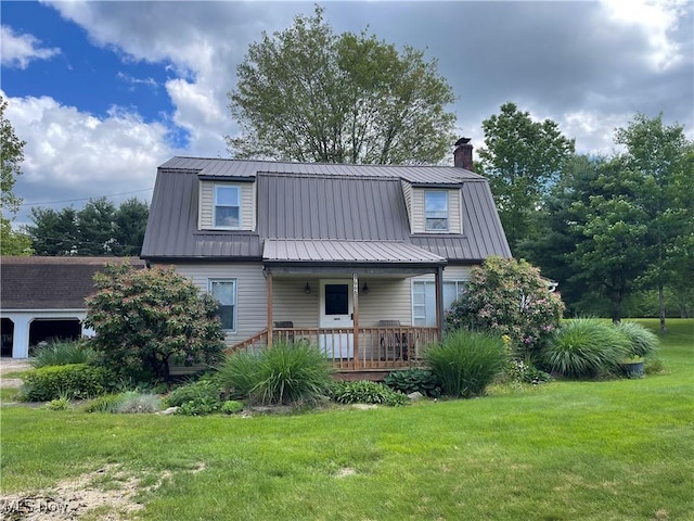 67966 Old Twenty One Rd, Cambridge, OH 43725 - view of front facade featuring covered porch, a chimney, a front yard, and a metal roof