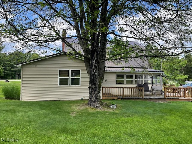 67966 Old Twenty One Rd, Cambridge, OH 43725 - back of property with a deck, a chimney, a yard, and a metal roof