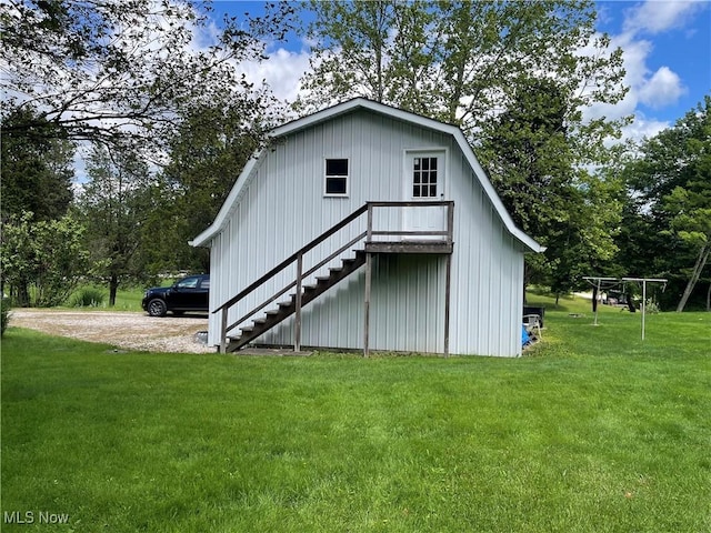 67966 Old Twenty One Rd, Cambridge, OH 43725 - back of property featuring stairs, a lawn, and board and batten siding
