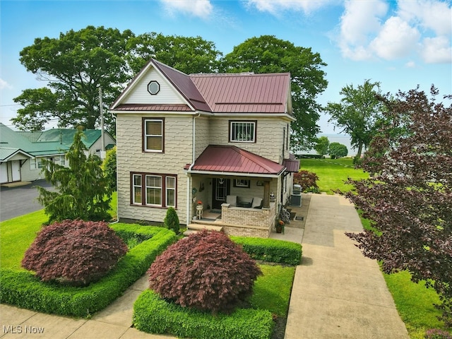 290-289 Park Ave, Conneaut, OH 44030 - victorian home featuring covered porch, a standing seam roof, and a metal roof
