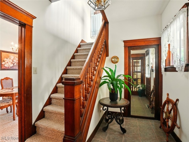 290-289 Park Ave, Conneaut, OH 44030 - staircase featuring baseboards and tile patterned floors