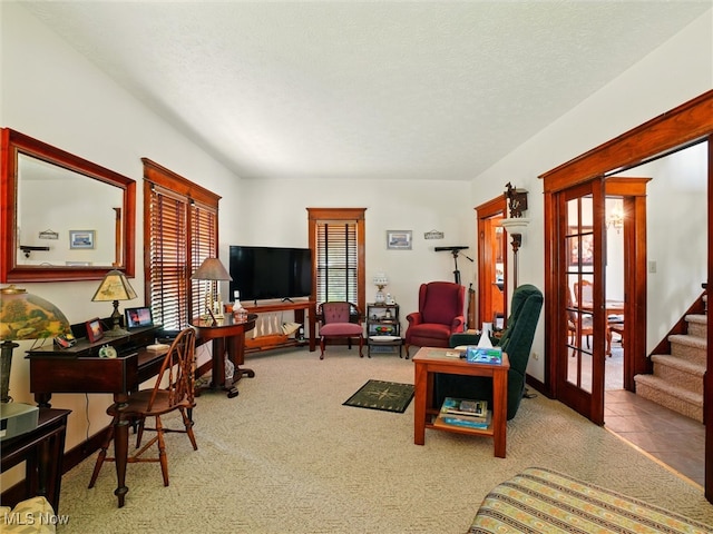 290-289 Park Ave, Conneaut, OH 44030 - living room featuring carpet, french doors, a textured ceiling, and stairway