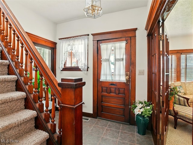 290-289 Park Ave, Conneaut, OH 44030 - entrance foyer featuring stairway and dark tile patterned floors