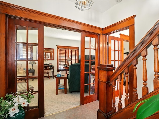 290-289 Park Ave, Conneaut, OH 44030 - carpeted foyer entrance with french doors, stairs, and tile patterned flooring