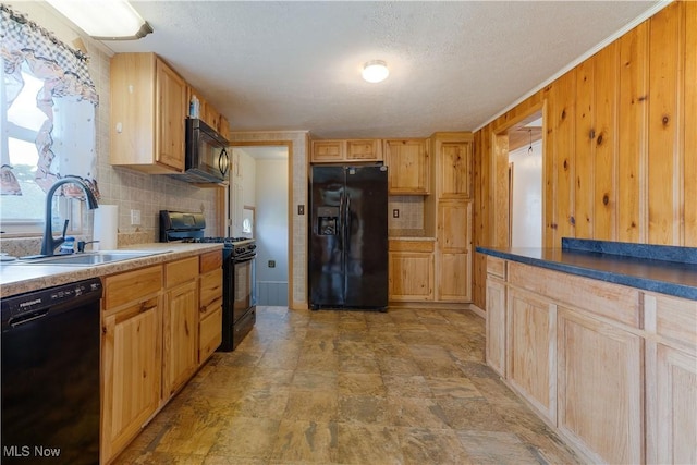 719 Pomeroy Pike, Belpre, OH 45714 - kitchen with black appliances, backsplash, wood walls, light brown cabinets, and stone finish floors