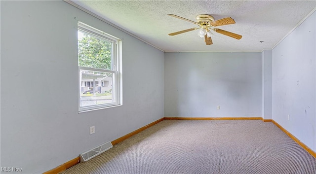 719 Pomeroy Pike, Belpre, OH 45714 - carpeted empty room featuring ceiling fan, a textured ceiling, and ornamental molding