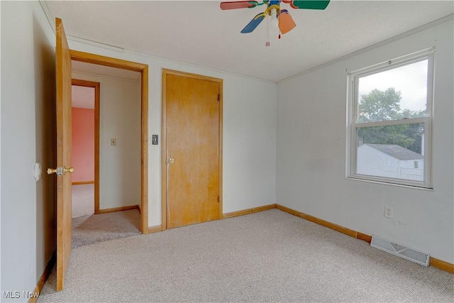719 Pomeroy Pike, Belpre, OH 45714 - spare room with carpet flooring, a ceiling fan, and crown molding