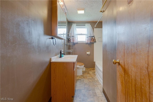 719 Pomeroy Pike, Belpre, OH 45714 - full bathroom with vanity, stone finish floors, a textured ceiling, and  shower combination