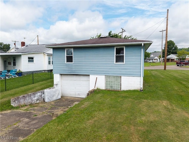 719 Pomeroy Pike, Belpre, OH 45714 - view of side of home with a garage and asphalt driveway