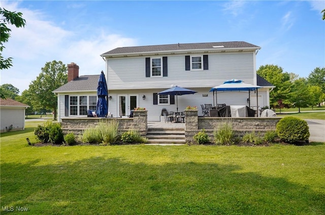220 Long Rd, Macedonia, OH 44056 - rear view of property with a yard, a deck, outdoor dining space, a chimney, and french doors