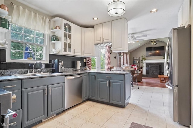 220 Long Rd, Macedonia, OH 44056 - kitchen featuring stainless steel appliances, gray cabinetry, ceiling fan, a peninsula, and lofted ceiling