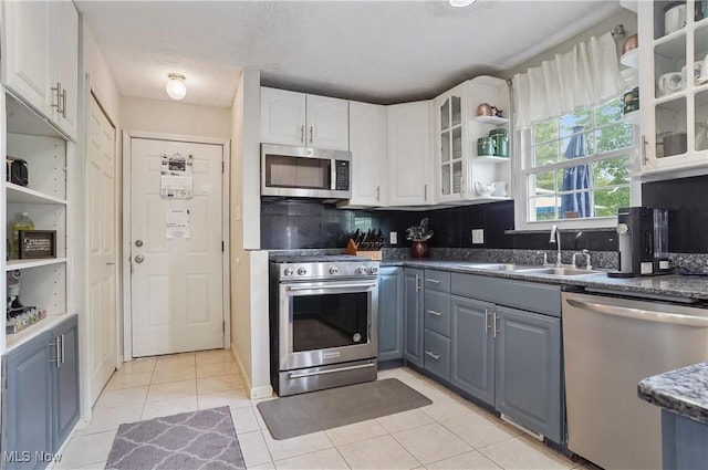 220 Long Rd, Macedonia, OH 44056 - kitchen featuring stainless steel appliances, white cabinets, open shelves, and light tile patterned floors