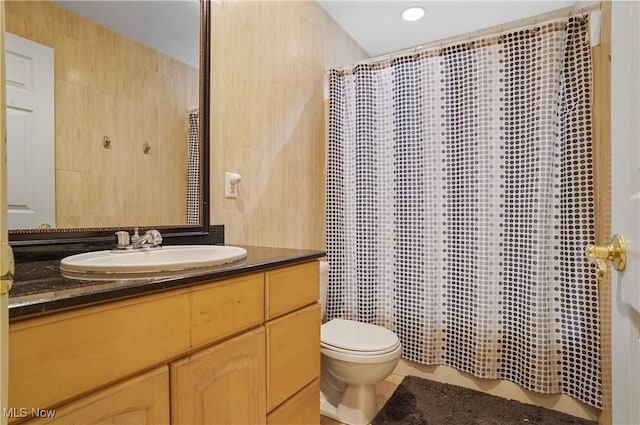 220 Long Rd, Macedonia, OH 44056 - bathroom with vanity, curtained shower, tile walls, and tile patterned flooring