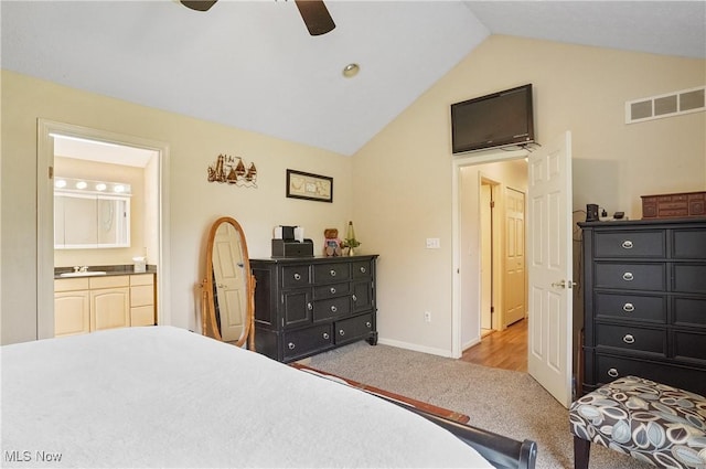 220 Long Rd, Macedonia, OH 44056 - bedroom featuring vaulted ceiling, carpet, connected bathroom, and ceiling fan