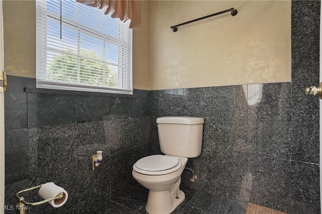 220 Long Rd, Macedonia, OH 44056 - bathroom featuring tile walls and a wainscoted wall