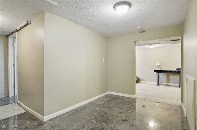 220 Long Rd, Macedonia, OH 44056 - hallway featuring a textured ceiling and baseboards