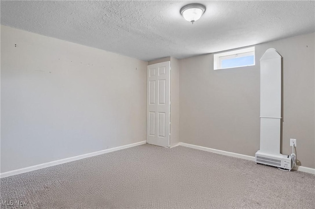 220 Long Rd, Macedonia, OH 44056 - basement featuring a textured ceiling and carpet
