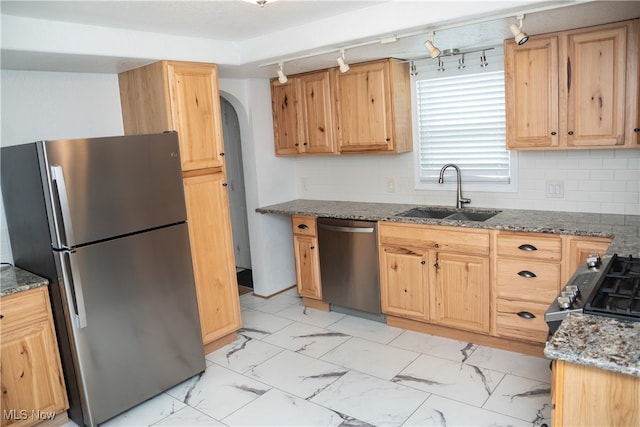 7355 Westview Dr, Boardman, OH 44512 - kitchen with appliances with stainless steel finishes, light marble finish flooring, rail lighting, light brown cabinets, and dark stone counters