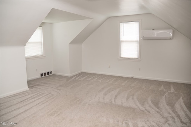 7355 Westview Dr, Boardman, OH 44512 - bonus room with a wall mounted air conditioner, carpet, and vaulted ceiling