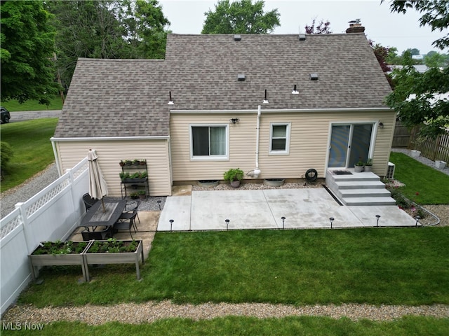 7355 Westview Dr, Boardman, OH 44512 - rear view of house with a patio area, a shingled roof, a fenced backyard, and a chimney
