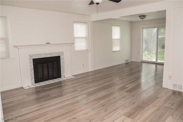 7355 Westview Dr, Boardman, OH 44512 - unfurnished living room featuring a ceiling fan, wood finished floors, and a fireplace