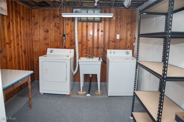 7355 Westview Dr, Boardman, OH 44512 - laundry room with washing machine and dryer, wood walls, and carpet