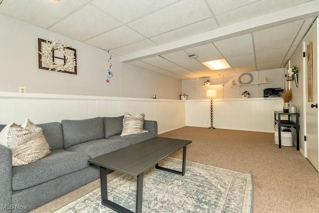 1657 Kasserine Ct, Twinsburg, OH 44087 - living room featuring a paneled ceiling, a wainscoted wall, and carpet flooring