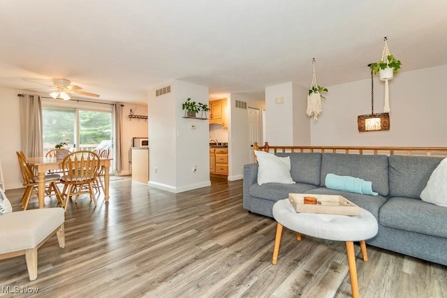 1657 Kasserine Ct, Twinsburg, OH 44087 - living room with light wood finished floors and a ceiling fan