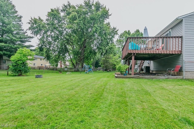 1657 Kasserine Ct, Twinsburg, OH 44087 - fenced backyard with a deck, a playground, and stairway