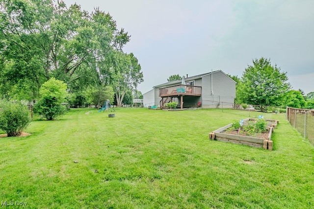 1657 Kasserine Ct, Twinsburg, OH 44087 - view of yard featuring a vegetable garden and a deck