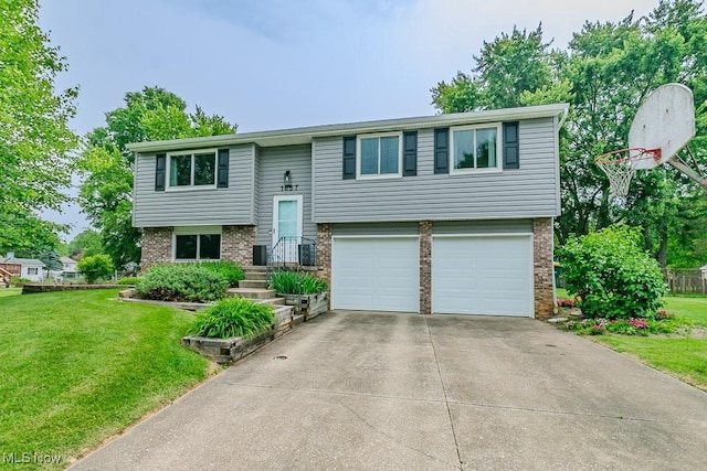 1657 Kasserine Ct, Twinsburg, OH 44087 - split foyer home featuring brick siding, a garage, and a front yard