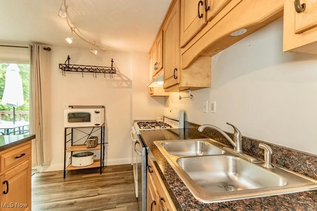 1657 Kasserine Ct, Twinsburg, OH 44087 - kitchen with range with gas stovetop, dark countertops, dark wood-style flooring, and white microwave