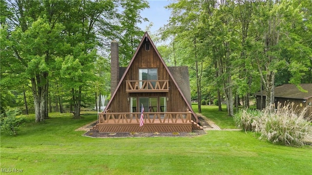 52 Arbor Rd NE, Minerva, OH 44657 - back of property featuring a chimney, a lawn, and a wooden deck
