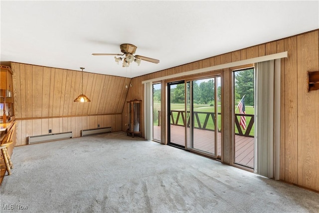 52 Arbor Rd NE, Minerva, OH 44657 - unfurnished living room with a baseboard radiator, wood walls, a baseboard heating unit, carpet flooring, and ceiling fan