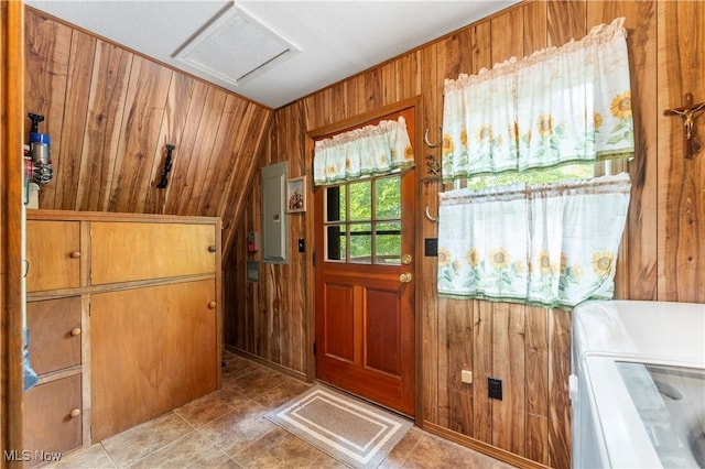 52 Arbor Rd NE, Minerva, OH 44657 - entryway with wood walls, electric panel, washer and dryer, vaulted ceiling, and tile patterned flooring