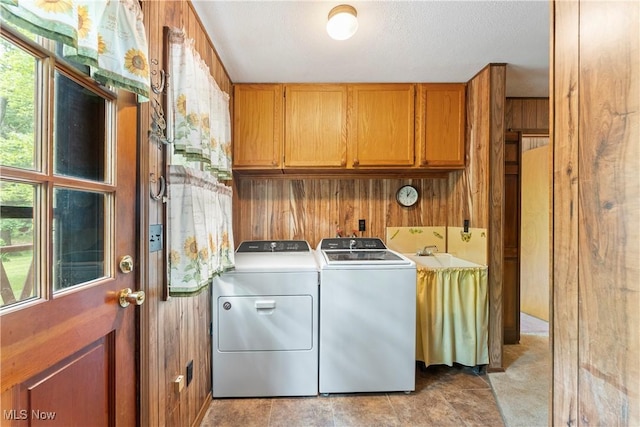 52 Arbor Rd NE, Minerva, OH 44657 - laundry area with cabinet space, independent washer and dryer, and wood walls