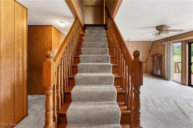 52 Arbor Rd NE, Minerva, OH 44657 - staircase featuring carpet floors, wooden walls, and a ceiling fan