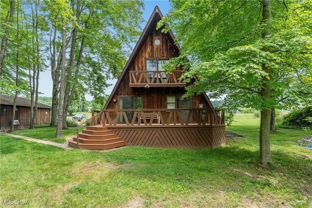 52 Arbor Rd NE, Minerva, OH 44657 - rear view of property with a lawn and a wooden deck
