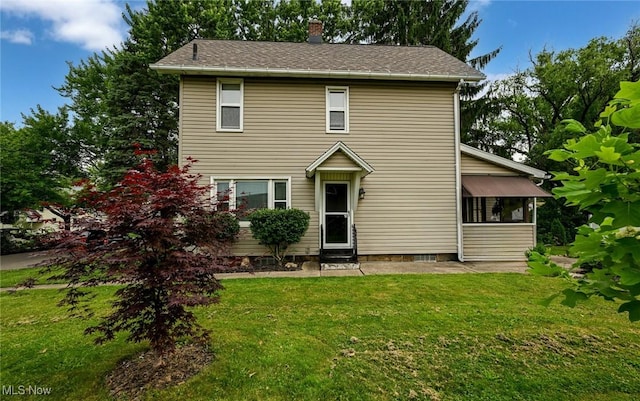 858 11th St NE, Massillon, OH 44646 - traditional home with a chimney, a front lawn, and entry steps
