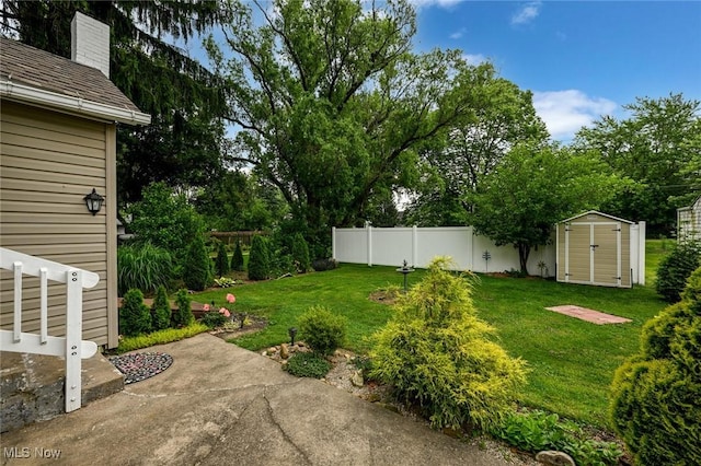 858 11th St NE, Massillon, OH 44646 - view of yard featuring a storage shed and view of wooded area