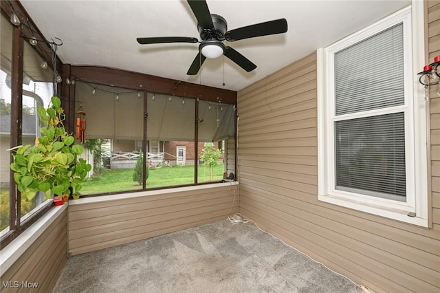 858 11th St NE, Massillon, OH 44646 - unfurnished sunroom featuring a ceiling fan