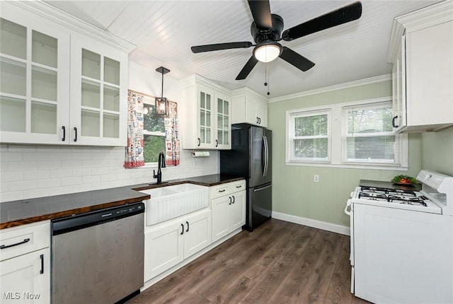 858 11th St NE, Massillon, OH 44646 - kitchen with white gas range, stainless steel dishwasher, freestanding refrigerator, decorative backsplash, and glass insert cabinets