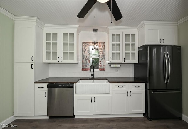858 11th St NE, Massillon, OH 44646 - kitchen featuring stainless steel appliances, dark countertops, ceiling fan, and white cabinets