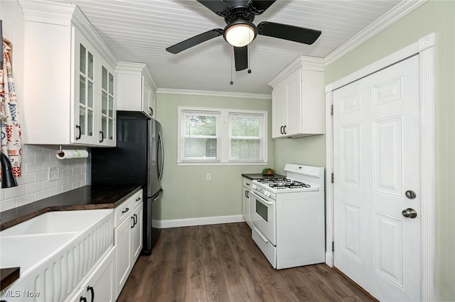 858 11th St NE, Massillon, OH 44646 - kitchen with white range with gas stovetop, white cabinetry, glass insert cabinets, tasteful backsplash, and dark wood-style floors