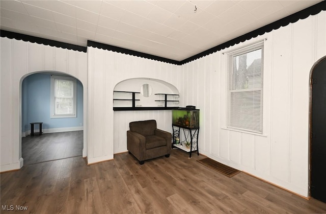 858 11th St NE, Massillon, OH 44646 - sitting room with arched walkways and wood finished floors