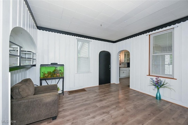 858 11th St NE, Massillon, OH 44646 - sitting room featuring arched walkways and wood finished floors