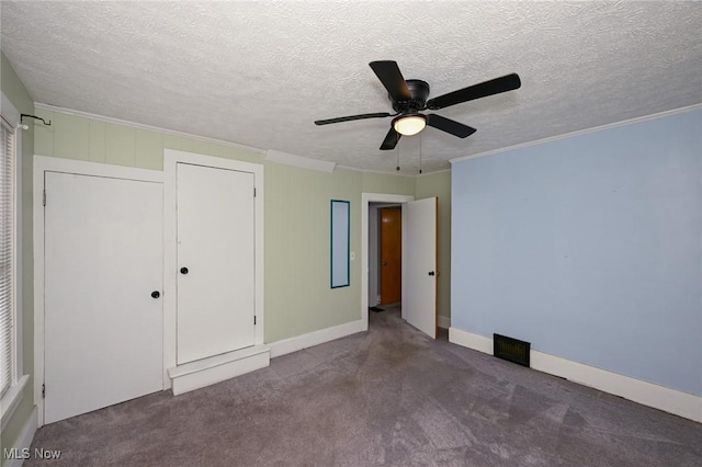 858 11th St NE, Massillon, OH 44646 - unfurnished bedroom with ornamental molding, carpet floors, a textured ceiling, ceiling fan, and a closet